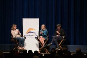 Jenny Cooney moderating panel with Margot Robbie at Australians in Film